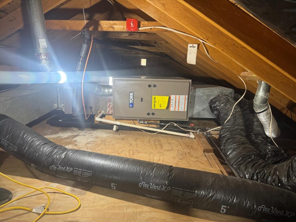 York gas furnace and air handler installed in a home attic with insulated flex ductwork