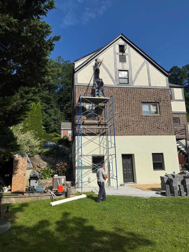 HVAC installation on a residential home with a new exterior condenser unit